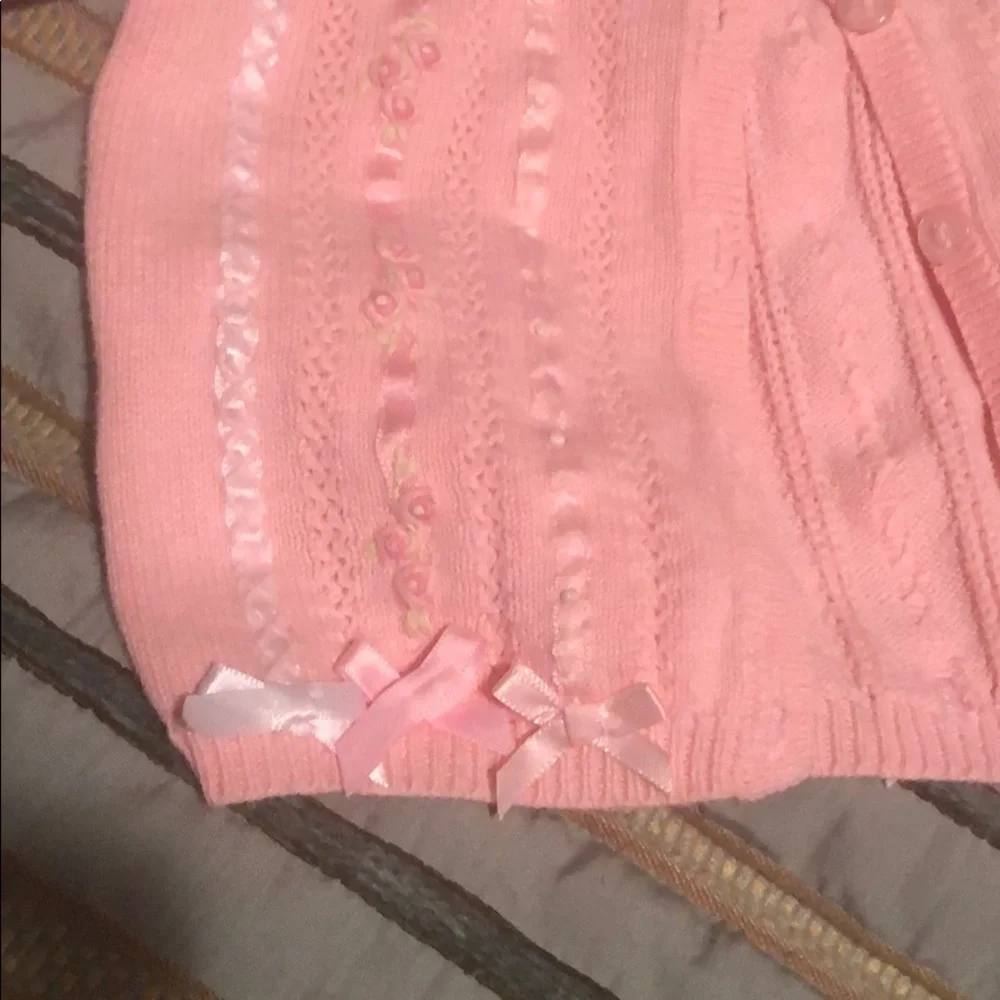 Pink button down sweater from Hartstrings